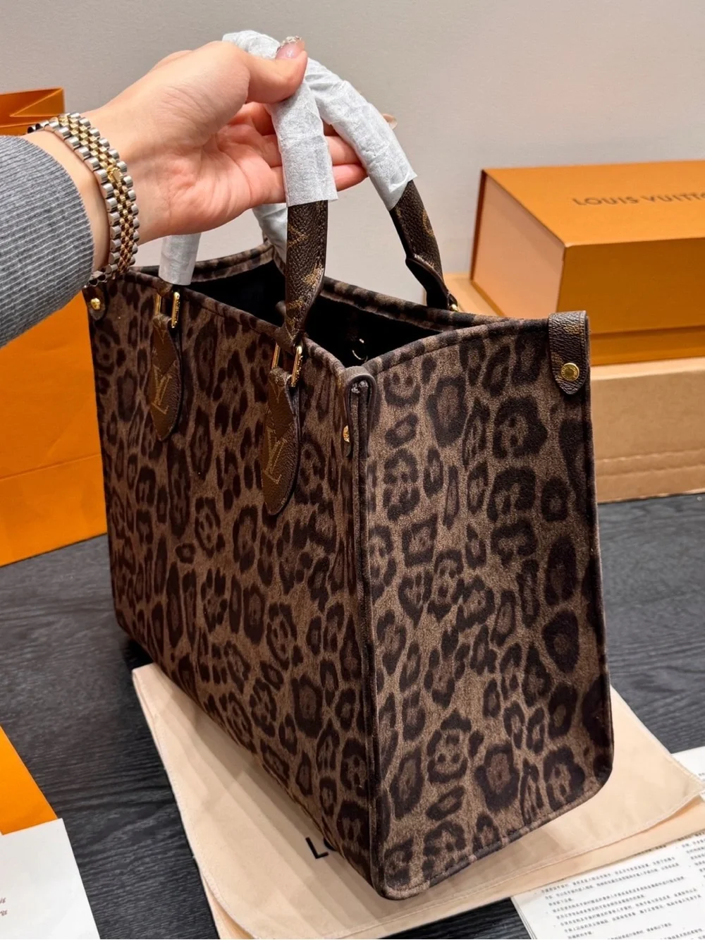 Louis Vuitton Leopard-Print Tote in Brown